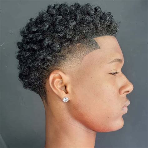 For a modern, edgy look, craft a faux hawk temple fade to match the uniqueness of your style. . Curly temp fade